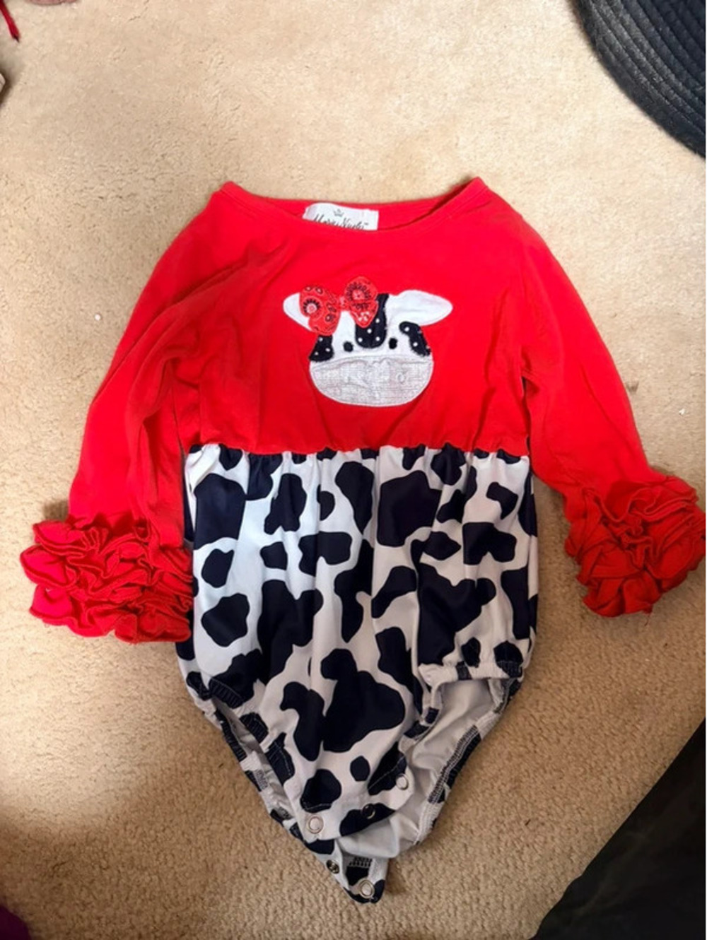 Adorable ruffle cow bubble romper girl